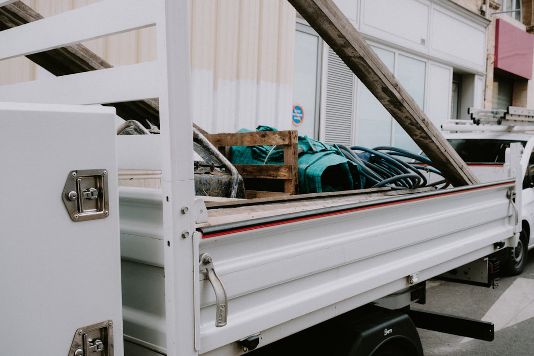 a white truck with a bunch of items in the back