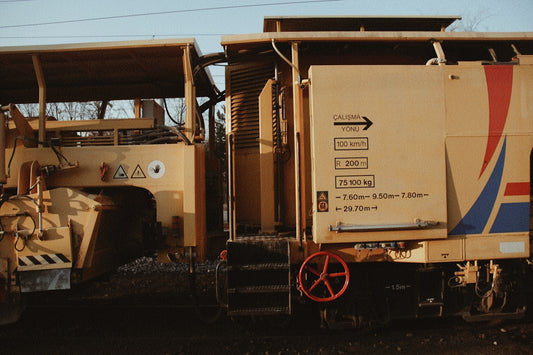 brown and white truck on black asphalt road during daytime