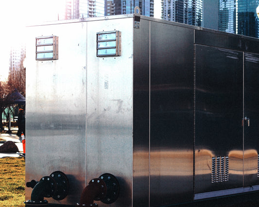black car parked beside white building