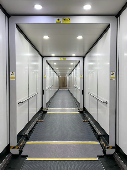 a long hallway with glass doors