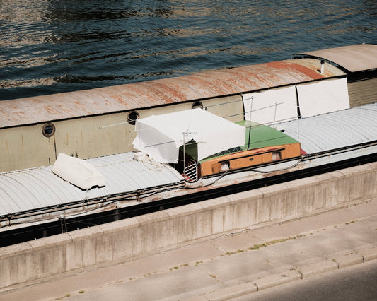 a building with a body of water in the background