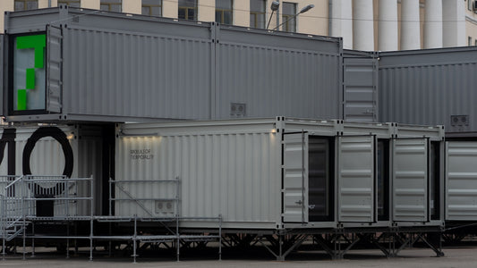 a row of shipping containers sitting next to each other