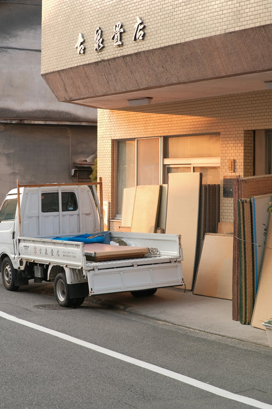 a white truck parked in front of a building