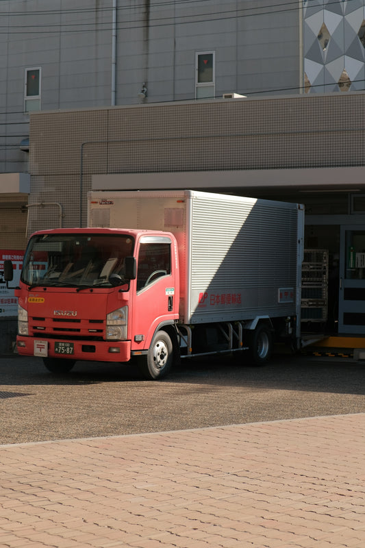 a red truck parked in front of a building