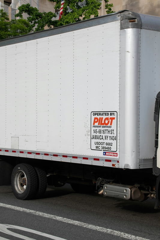 a delivery truck parked on the side of the road