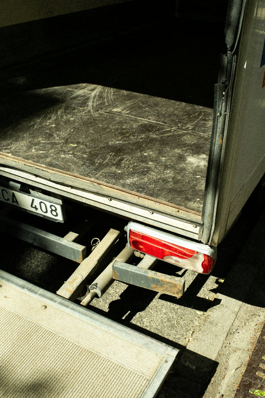 The back of a truck with a ramp attached to it