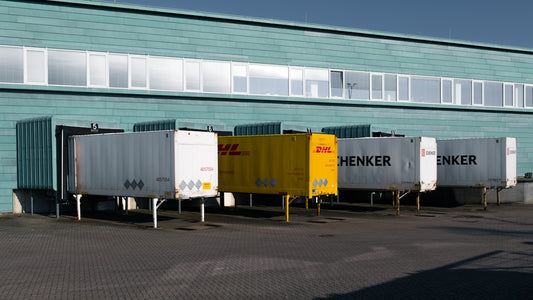 A group of trucks parked in front of a building