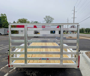 Aluminum trailer with wooden floor on a paved road, featuring 'Silver Ox' branding.