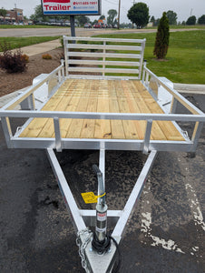 Silver Ox Aluminum utility trailer with wooden floor on a paved surface
