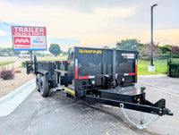 Black Griffin trailer parked on a street with a 'Trailer Sales & Parts' sign in the background.