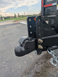 Adjustable coupler on Griffin Dump trailer with a blurred background
