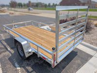 Silver Ox Aluminum trailer with wooden floor on a paved surface at AAA Trailer In Howell MI
