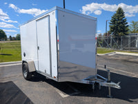 2026 AmeraLite Storm 6x10 White aluminum enclosed trailer — front angle showing poly composite exterior and V-nose | AAA Trailer