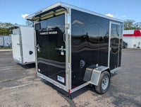 2026 AmeraLite Storm 6x10 Black — ramp door open rear quarter showing poly composite exterior finish and Forest River branding | AAA Trailer