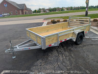 Silver Ox 6x12 Woody Aluminum Utility Trailer with Folding Ramp Gate — driver-side full profile showing woodside boards, all-aluminum frame and folding gate | AAA Trailer Howell MI