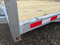 Silver Ox 7x10 Trailer — closeup of DOT-C2 red reflective conspicuity tape strips and weld-on tie-down D-ring loop on rear side rail