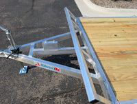 Silver Ox aluminum flat deck trailer with dovetail — side view