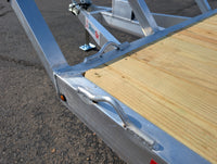 Welded aluminum tie-down loops on Silver Ox flat deck trailer frame