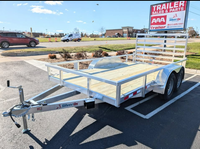 A tandem-axle Silver Ox aluminum utility trailer with a 2ft dovetail, rear ramp gate, and white structure.