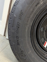 Rainier ST 235/80R16 10 Ply Tire with 16" Steel Wheel - alternate angle | AAA Trailer