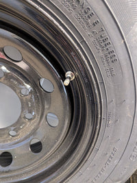 Rainier ST 235/80R16 10 Ply Tire with 16" Steel Wheel - close-up view | AAA Trailer