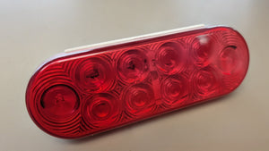 Red 6-1/2" oval LED trailer stop/tail/turn light – front view, red lens with 10 LED diodes, DOT FMVSS 108