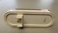 Red 6-1/2" oval LED trailer light – back of housing showing STOP/TAIL/GRND terminals, 12V DC, submersible sealed