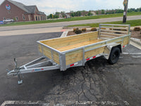 Silver Ox 6x12 Woody Aluminum Utility Trailer with Folding Ramp Gate — driver-side full profile showing woodside boards, all-aluminum frame and folding gate | AAA Trailer Howell MI