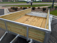 Silver Ox 6x12 Woody Woodside Trailer — overhead interior view showing 3-board wood sides, treated wood deck and bi-fold folding gate section | AAA Trailer