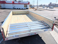 Silver Ox 7x14 aluminum trailer - rear three quarter view with folding ramp gate raised