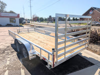 Silver Ox 7x16 tandem aluminum utility trailer - exterior side view showing dual axles and side ramps