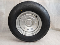 Taskmaster ST205/75R14 Radial Trailer Tire & 14" Silver Vesper Wheel - alternate angle | AAA Trailer