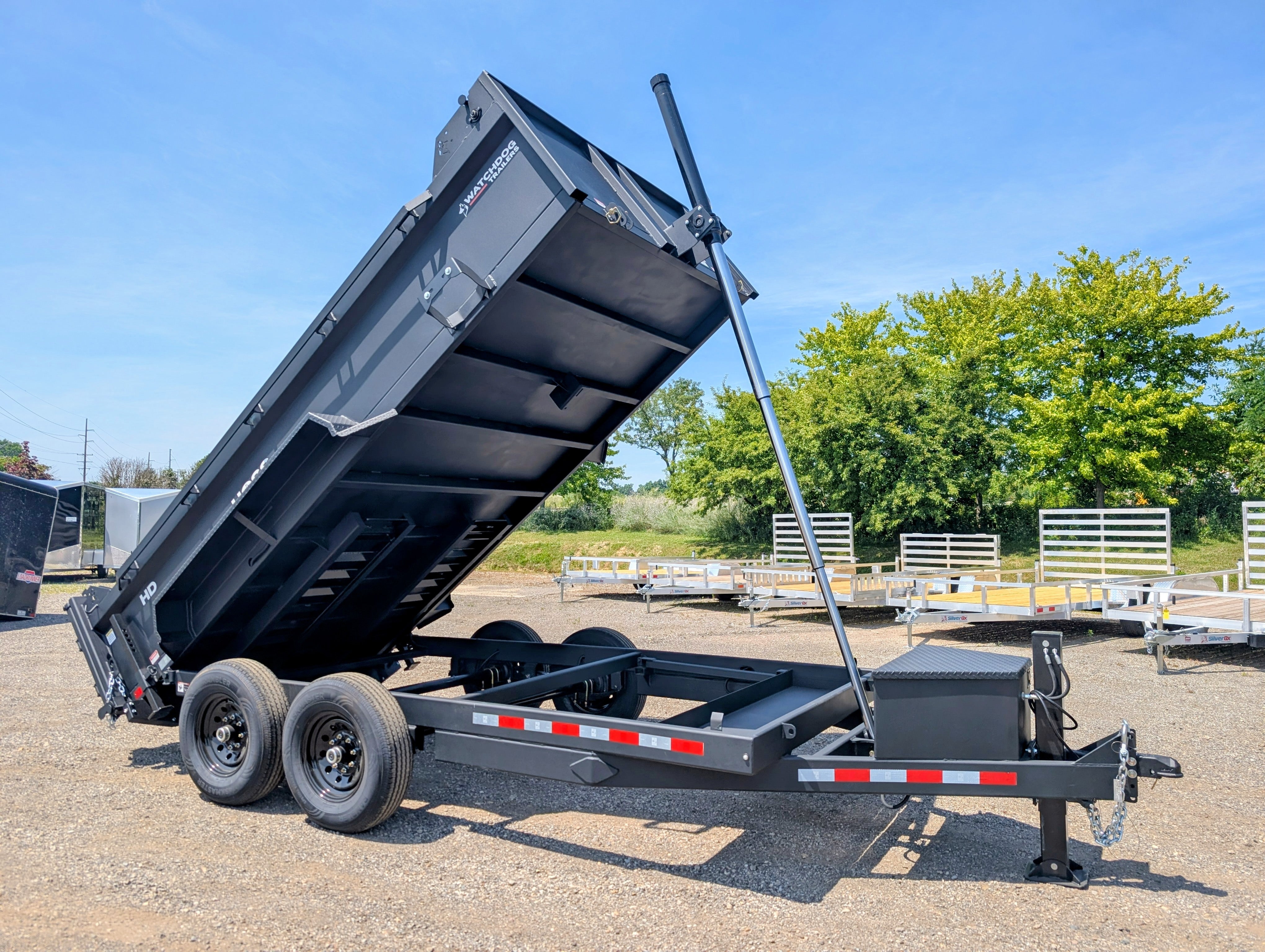 Watchdog HOSS 7x14 dump trailer, 14K GVWR telescopic with hydraulic power tongue jack — driver-side profile (1 of 18)