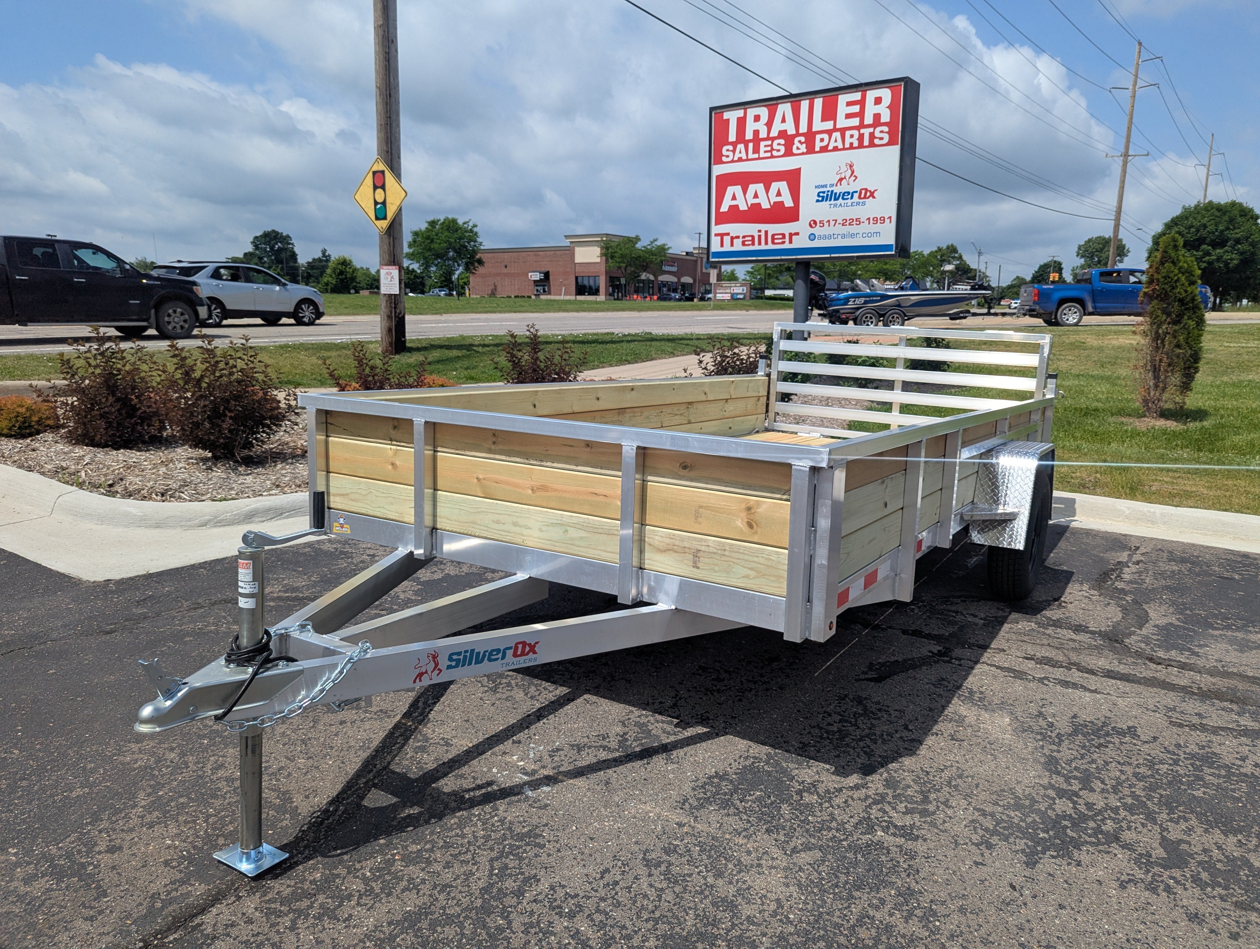 Silver Ox 7x14 aluminum ATV trailer with 18 inch wood sides and folding rear ramp gate - main product photo at AAA Trailer in Howell Michigan