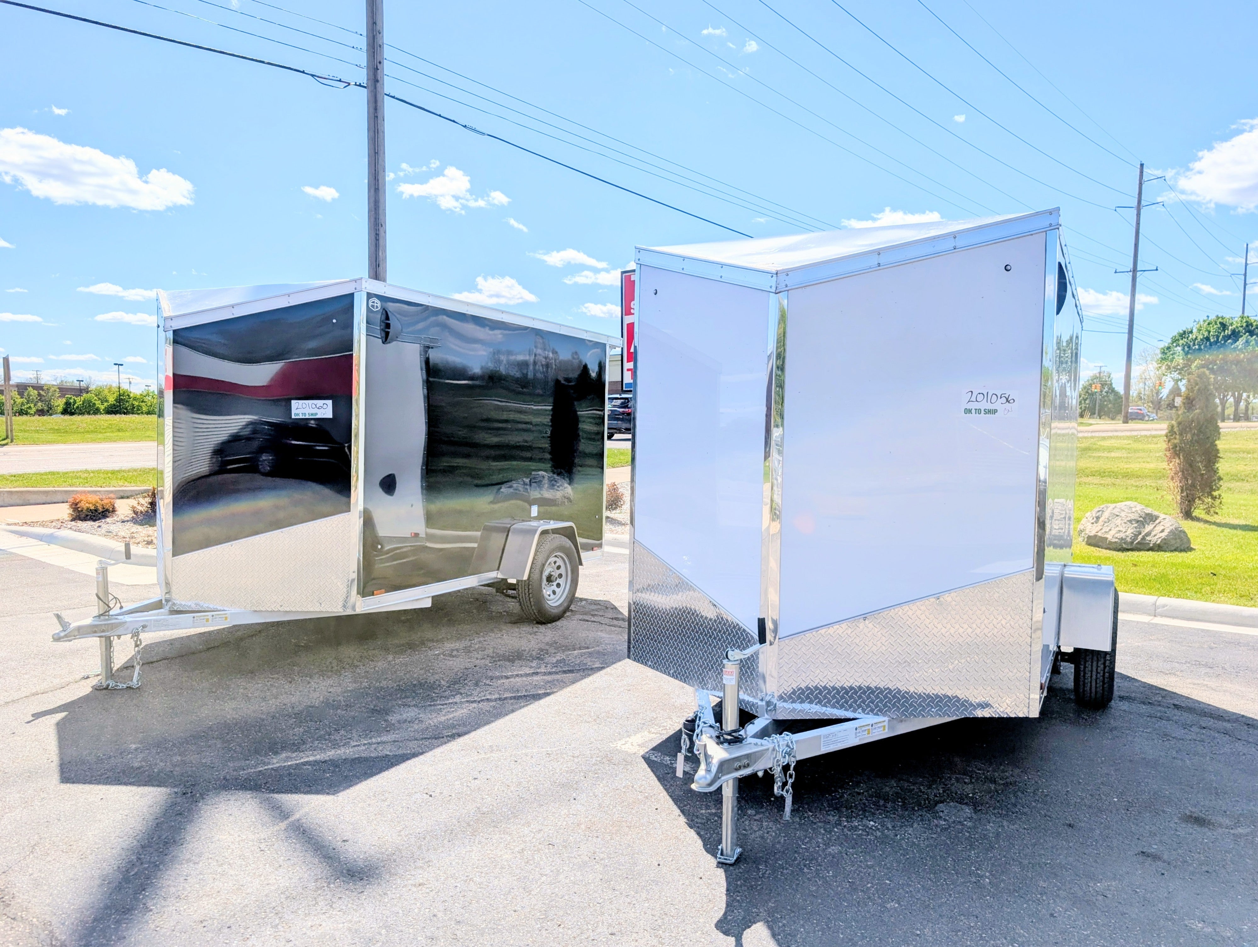 2026 AmeraLite Storm 6x10 aluminum enclosed trailers — White and Black Spring Edition units on lot at AAA Trailer, Howell MI